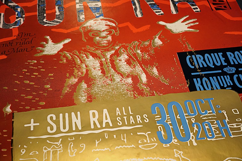 A vibrant design in red, gold, and blue shows an image of Sun Ra with his arms outstretched. Text reads "Sun Ra All Stars, 30 Oct 2011"